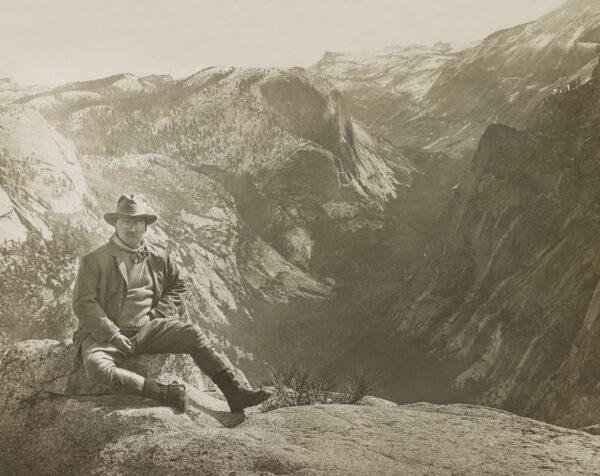 Theodore Roosevelt sits on a large rock at Glacier Point. (<a href="https://www.shutterstock.com/g/everett">Everett Collection</a>/<a href="https://www.shutterstock.com/image-photo/president-theodore-roosevelt-sitting-on-large-787302082">Shutterstock</a>)