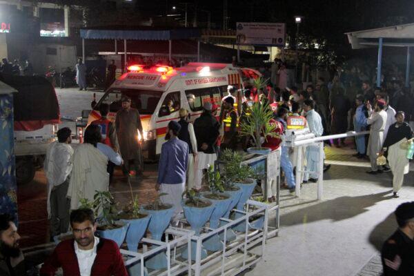 Rescue worker unload earthquake victims from an ambulance at a hospital in Saidu Sharif, a town Pakistan's Swat valley, on March 21, 2023. (Naveed Ali/AP Photo)