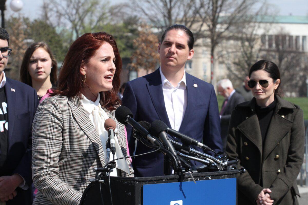 Moms for Liberty co-founder Tiffany Justice addresses the media near Capitol Hill in Washington on March 23, 2023. (Richard Moore/The Epoch Times)