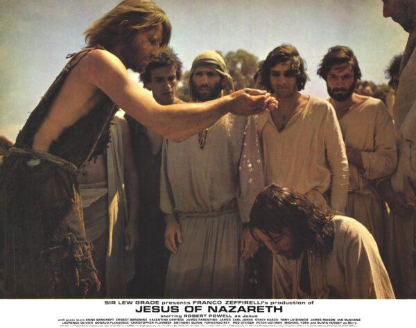 John the Baptist (Michael York, L) baptizes Jesus (Robert Powell), in "Jesus of Nazareth." (Movie StillsDB)