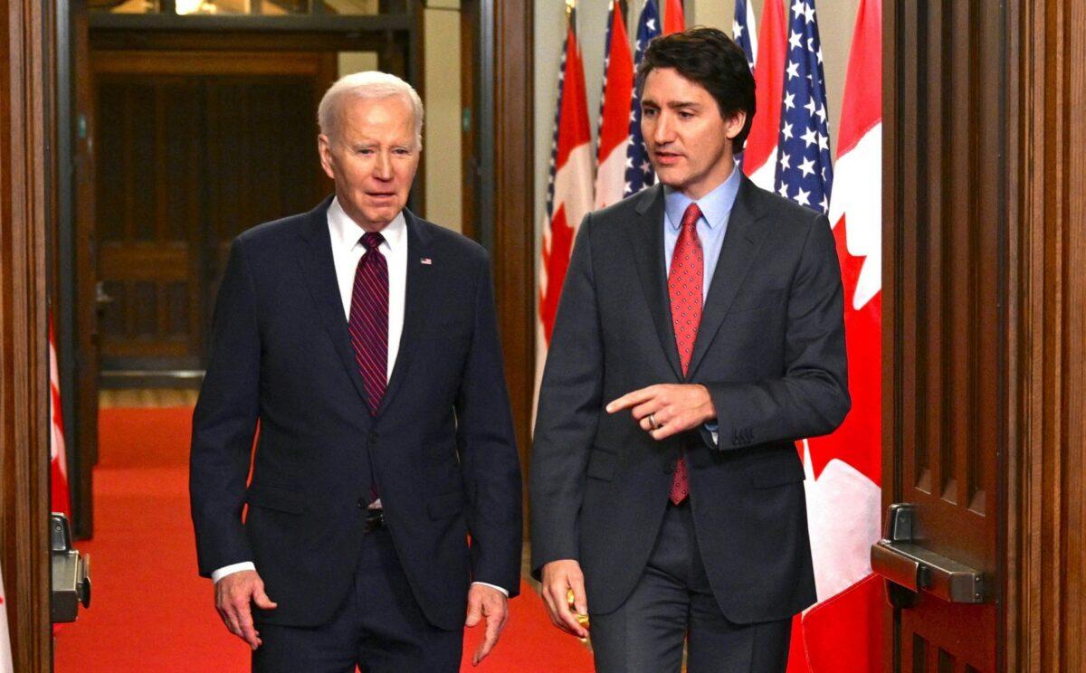 Canada's Prime Minister Justin Trudeau (R) walks with U.S. President Joe Biden after welcoming him at Parliament Hill in Ottawa, Canada, on March 24, 2023. (Mandel Ngan/AFP via Getty Images)