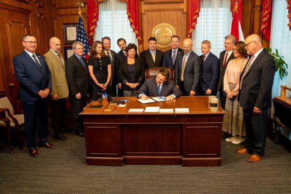 Gov. Ron DeSantis signs Florida House Bill 837, designed to decrease frivolous lawsuits in the state, at the Florida State Capitol on March 24, 2023. (Courtesy of the Office of Governor Ron DeSantis)