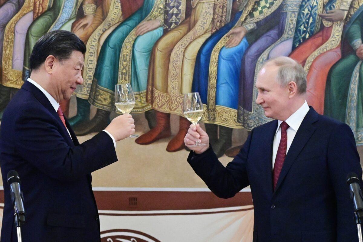 Chinese leader Xi Jinping and Russian leader Vladimir Putin make a toast during a dinner at the Kremlin in Moscow on March 21, 2023. (Pavel Byrkin, Sputnik, Kremlin Pool Photo via AP)