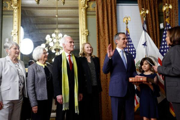 U.S. Vice President Kamala Harris ceremonially swears in Eric Garcetti as Ambassador to India at the Eisenhower Executive Office Building. He was joined (L-R) by his mother-in-law Dee Wakeland, mother Sukey Garcetti, father Gil Garcetti, wife Amy Wakeland and his daughter Maya Garcetti in Washington, DC., on March 24, 2023. (Anna Moneymaker/Getty Images)