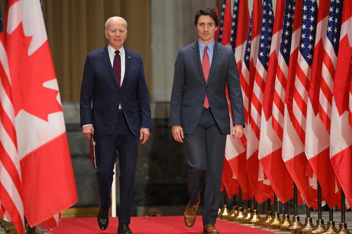 President Joe Biden (L) and Canadian Prime Minister Justin Trudeau arrive for a joint news conference at the Sir John A. Macdonald Building in Ottawa, Canada, on March 24, 2023. (Mandel Ngan/AFP via Getty Images)