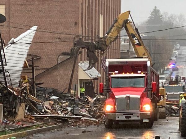 Rubble is cleared at the site of a deadly explosion at a chocolate factory in West Reading, Pa., on March 25, 2023. (Michael Rubinkam/AP Photo)