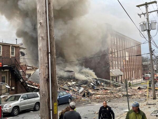 Emergency personnel work at the site of a deadly explosion at a chocolate factory in West Reading, Pa., on March 24, 2023. (Ben Hasty/Reading Eagle via AP)