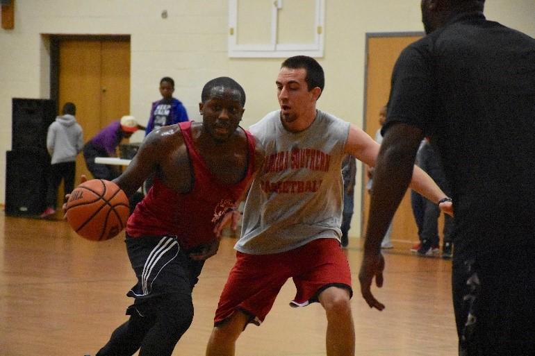 Lozano playing college basketball. (Courtesy of Marc Lozano)