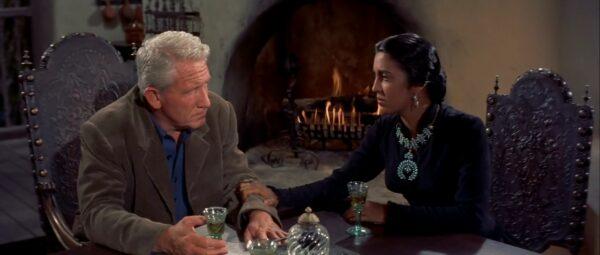Matt Devereaux (Spencer Tracy, L) talks with his wife Señora Devereaux (Katy Jurado), in “Broken Lance” (20th Century Fox)