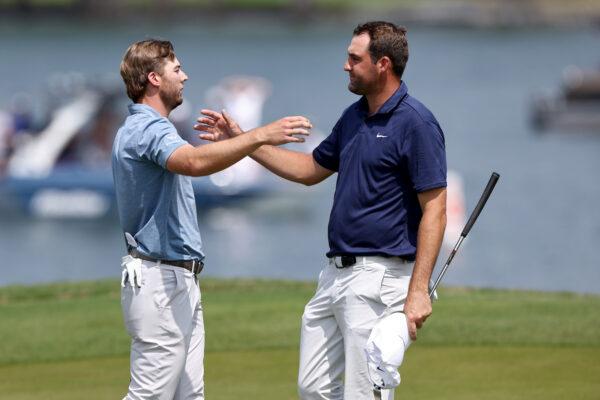 Sam Burns of the United States (L) and Scottie Scheffler of the United States meet on the 14th green after Burns won their match 1 up in a playoff during day five of the World Golf Championships-Dell Technologies Match Play at Austin Country Club on March 26, 2023 in Austin, Texas. (Tom Pennington/Getty Images)