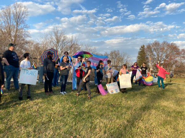 Trans activists picket the Moms for Liberty Town Hall meeting in Eldersburg, Md., on March 23, 2023. (Douglas Burton/The Epoch Times)
