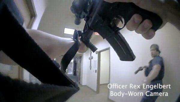 This image shows bodycam footage of police responding to an active shooting at The Covenant School in Nashville, Tenn., on March 27, 2023. The former student who shot through the doors of the Christian elementary school and killed three children and three adults had drawn a detailed school map. (Metropolitan Nashville Police Department via AP)