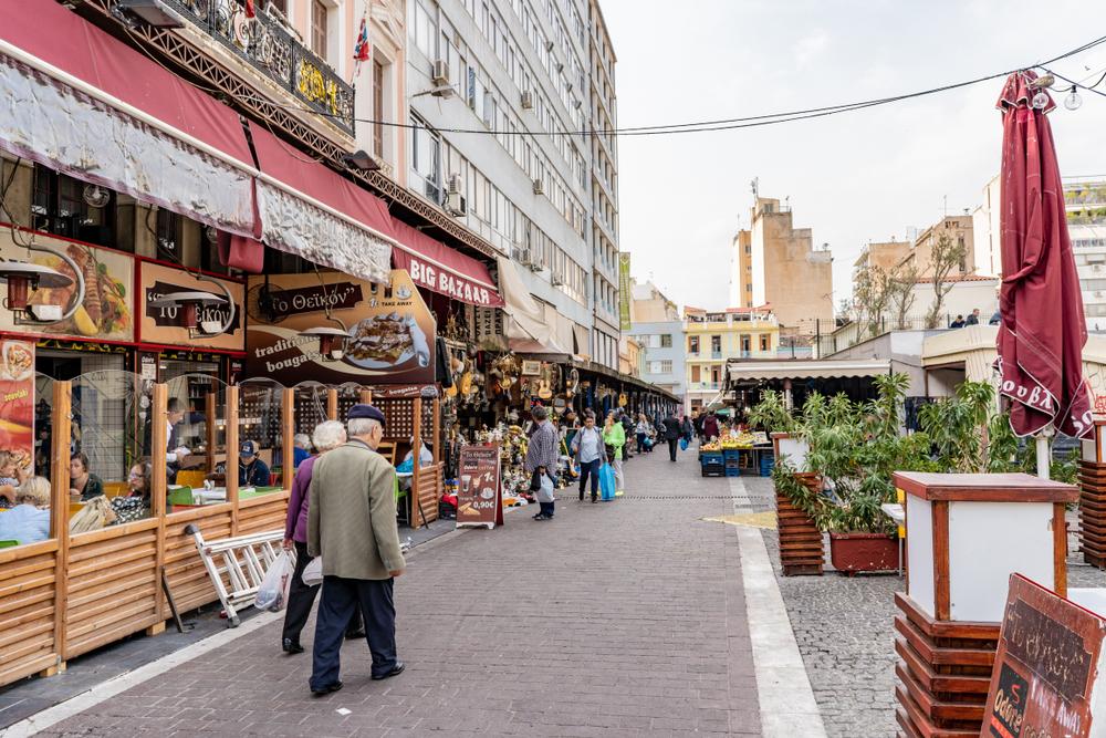 Tourists and locals enjoy the Psiri neighborhood, an area of Athens known for its vibrant nightlife and great dining opportunities. (Page Light Studios/Shutterstock)