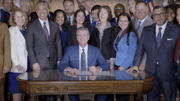 California Governor Gavin Newsom signs a price-gouging penalty bill for oil companies on March 28, 2023. (Screenshot via YouTube/California Governor Gavin Newsom)