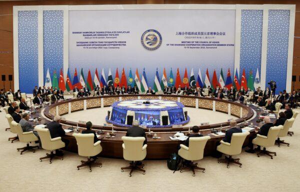 Participants of the Shanghai Cooperation Organization summit attend an extended-format meeting of heads of SCO member states in Samarkand, Uzbekistan, on Sept. 16, 2022. (Sergey Bobylev/Sputnik/Pool via Reuters)