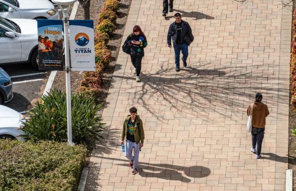People walk on campus at California State University–Fullerton in Fullerton, Calif., on March 8, 2023. (John Fredricks/The Epoch Times)