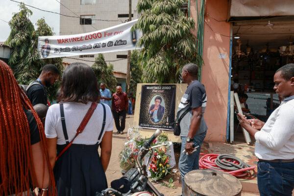 Mourners gather in the courtyard of Radio Amplitude FM, during a tribute ceremony for journalist Martinez Zogo, in the Elig Essono district of Yaounde on January 23, 2023. (Daniel Beloumou Olomo/AFP via Getty Images)