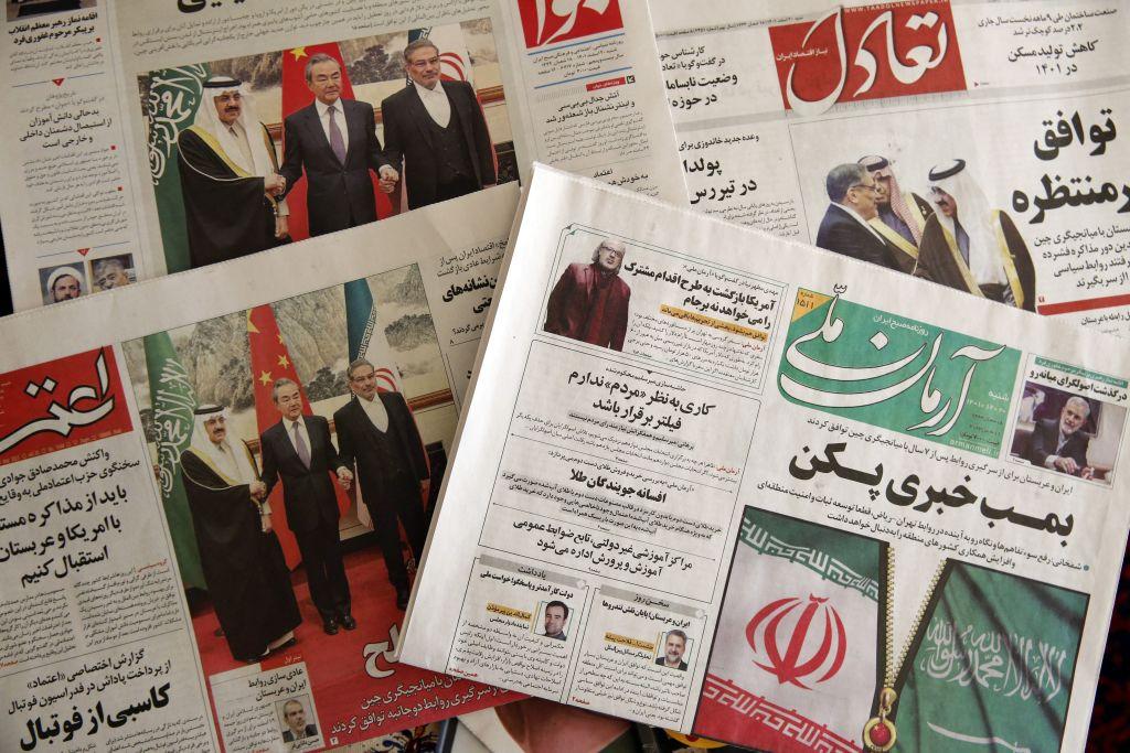 Newspapers in Tehran feature front-page news stories about the China-brokered deal between Iran and Saudi Arabia to restore ties, which was signed in Beijing the previous day, on March 11, 2023. (Atta Kenare/AFP via Getty Images)