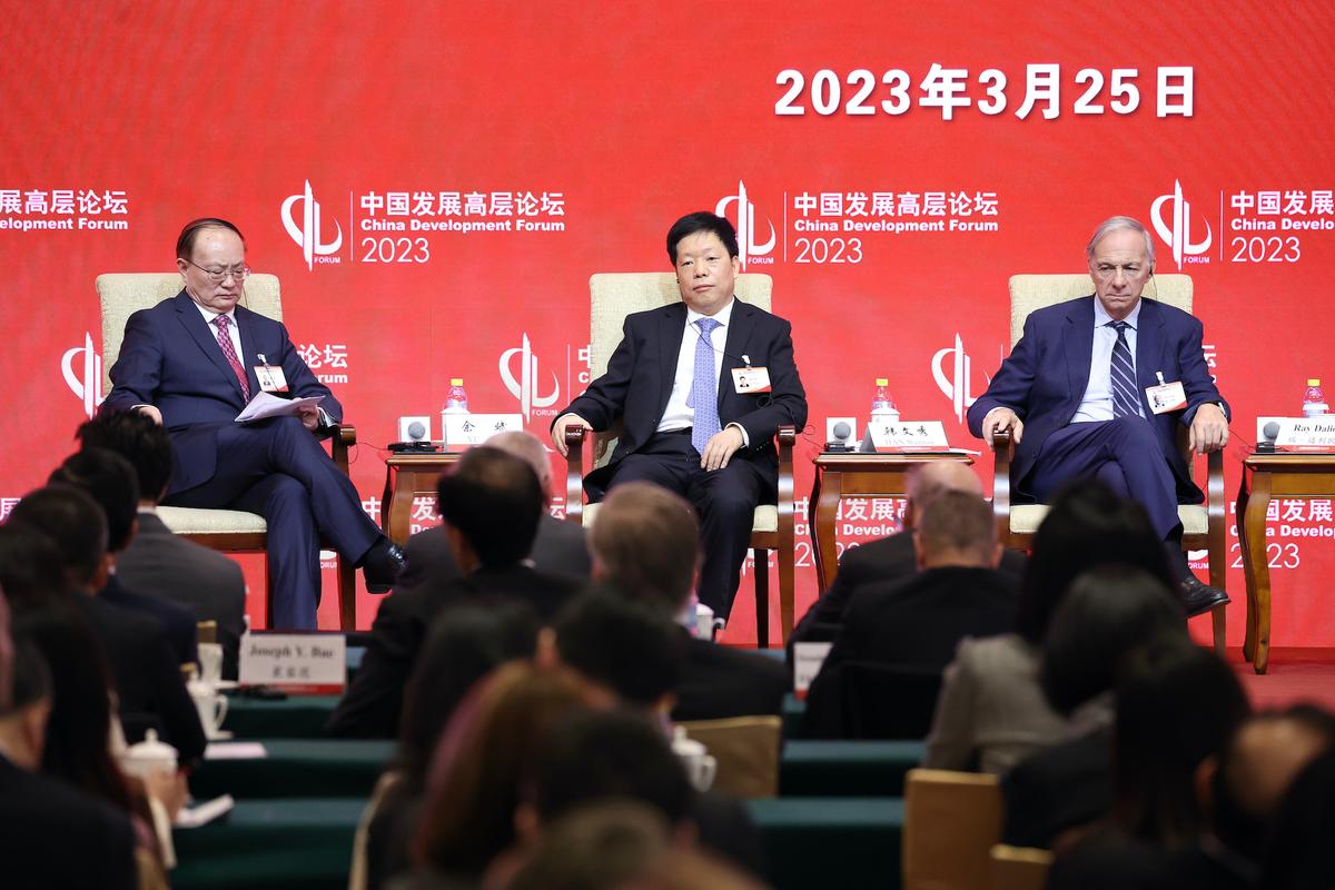 (L-R) Yu Bin, Vice President Development Research Center of the State Council, Han Wenxiu, Executive Deputy Director of the General Office of the Central Financial, Ray Dalio, founder of Bridgewater Associates LP, during China Development Forum 2023 at Diaoyutai State Guesthouse on March 25, 2023, in Beijing, China. (Lintao Zhang/Getty Images)