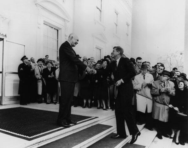 President Dwight Eisenhower greets President-elect John F Kennedy, at the North Portico of the White House in Washington, DC, on Dec. 6, 1960. (Photo by MPI/Getty Images)