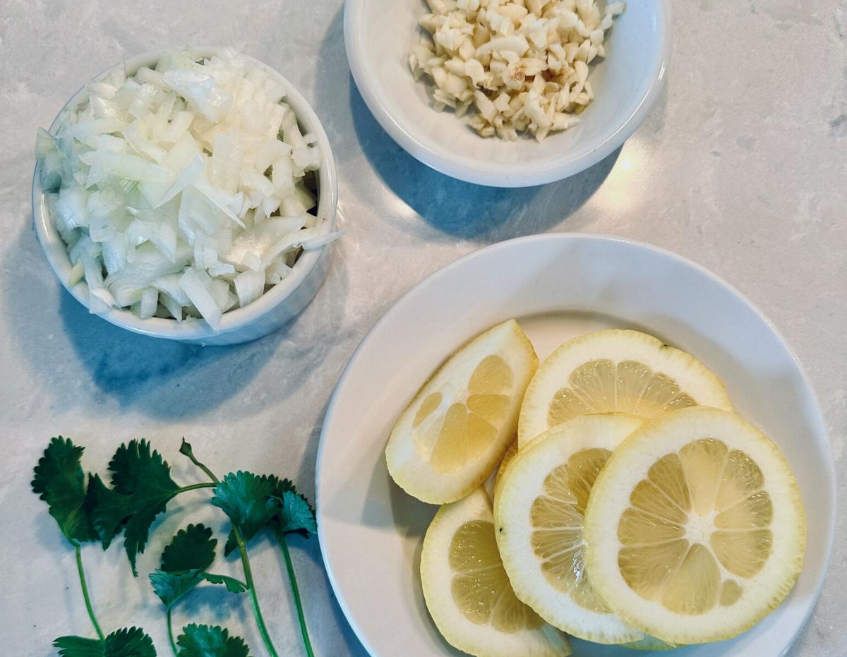 Onions, garlic, parsley, and plenty of fresh lemons go into the sauce. (Courtesy of Amy Dong)