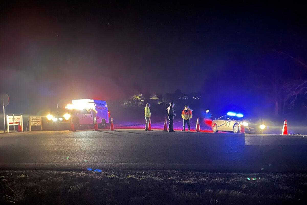 Emergency responders near a site where two military helicopters crashed Wednesday night during a routine training mission in Trigg County in southwestern Kentucky on March 30, 2023. (Brandon Smith/WSMV-TV via AP)