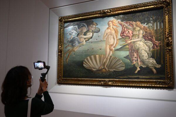 A visitor takes a video with her smartphone of Sandro Botticelli's Renaissance masterpiece "The Birth of Venus" at the Uffizi Galleries in Florence, Italy on Jan. 21, 2021. (Vincenzo Pinto/AFP via Getty Images)