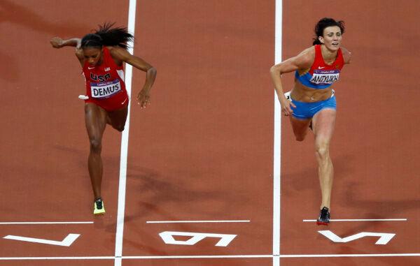 Russia's Natalya Antyukh (right) powers ahead of United States' Lashinda Demus to win gold in the women's 400-meter hurdles final during the athletics in the Olympic Stadium at the 2012 Summer Olympics in London on Aug. 8, 2012. (Daniel Ochoa De Olza/AP Photo)