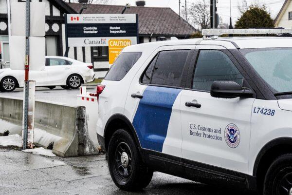 A U.S. Customs and Border Protection vehicle waits outside the port of entry at the U.S.-Canada border in New York on March 22, 2023. (Allan Stein/The Epoch Times)