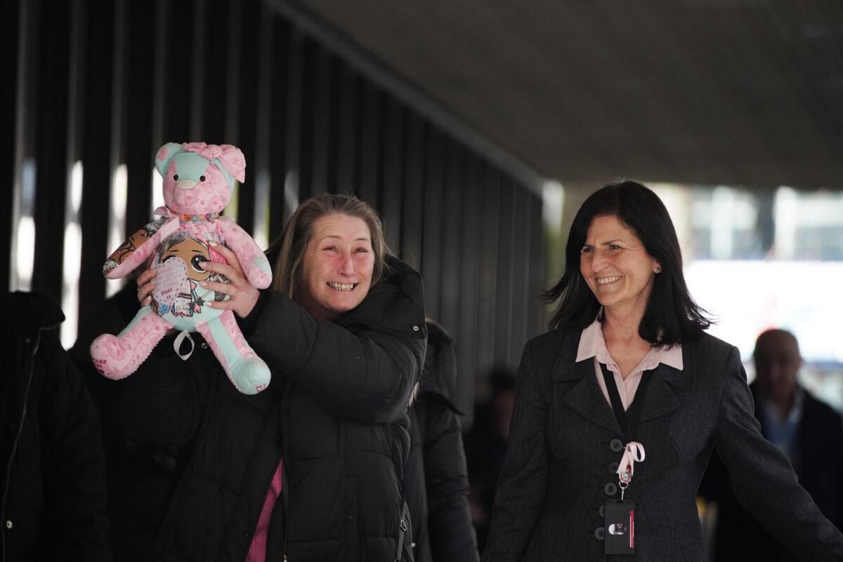 After Thomas Cashman was found guilty of murdering her daughter in August 2022, Cheryl Korbel (left), mother of nine-year-old Olivia Pratt-Korbel holds a teddy bear outside Manchester Crown Court, on March 30, 2023. (Peter Byrne/ PA media)