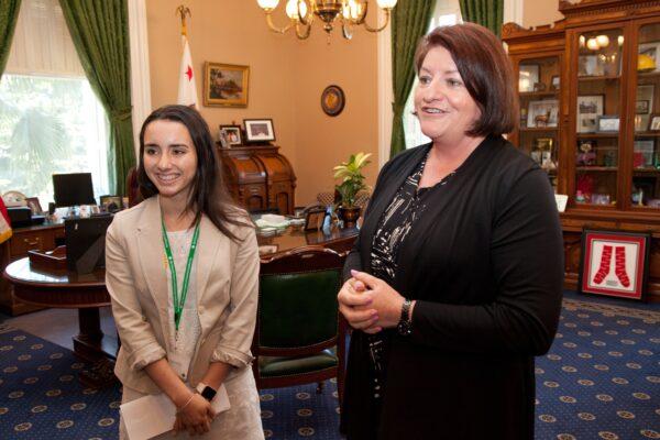 Gold Award recipient Isabella Pena (L) of Girl Scouts of San Gorgonio joins a meeting with Speaker Emeritus Toni Atkins at the California State Capitol in Sacramento, Calif., on June 22, 2016. (Kelly Sullivan/Getty Images for Girl Scouts)