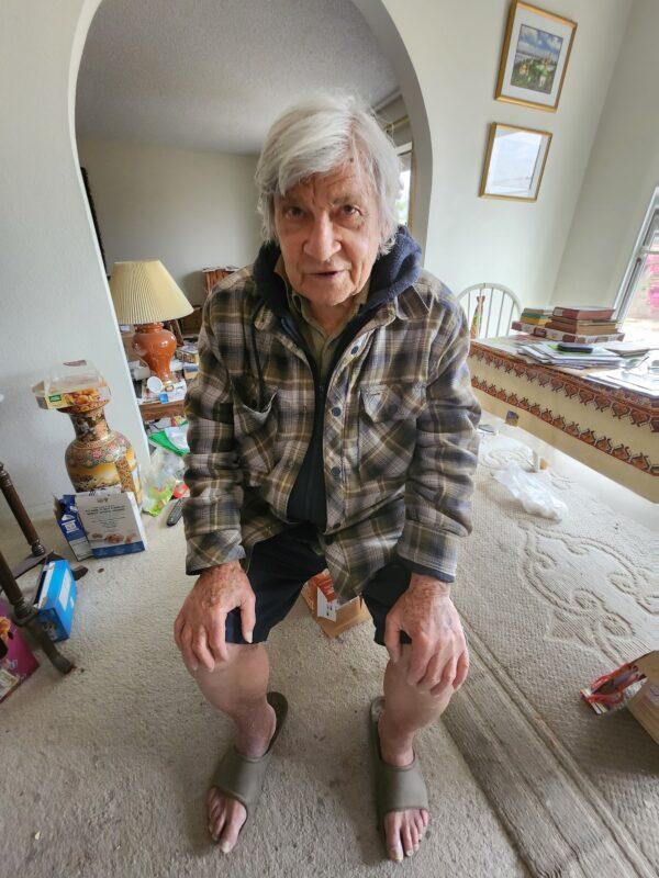 George Ilinsky, 91, sits in his living room in Phoenix on March 21, 2023. (Allan Stein/The Epoch Times)