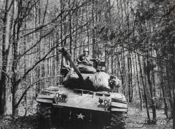 George Ilinsky in a U.S. Army tank patrolling the East German border during the 1950s. (Allan Stein/The Epoch Times)