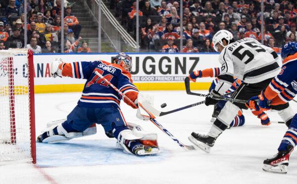 Los Angeles Kings' Quinton Byfield (55) is stopped by Edmonton Oilers goalie Stuart Skinner (74) during the third period of an NHL hockey game, in Edmonton, Alberta, Canada, on March 30, 2023. (Jason Franson/The Canadian Press via AP)