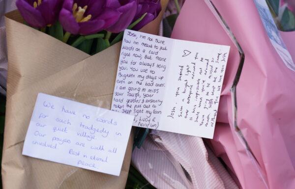 Flowers with messages left at the scene in Meridian Close, Bluntisham, Cambridgeshire, on March 30, 2023. (PA Media)