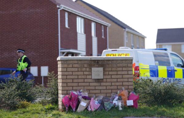 Flowers left at the scene in Meridian Close, Bluntisham, Cambridgeshire, on Mar. 30, 2023. (PA Media)