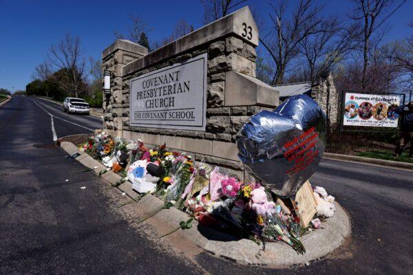 A balloon with names of the victims is seen at a memorial at the entrance to The Covenant School, in Nashville, Tenn., on March 29, 2023. (Wade Payne/AP Photo)