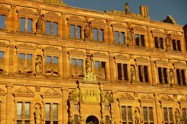 The Ottheinrich building, a roofless structure located on the right side of the courtyard, is one of the most beautiful structures of the German Renaissance. Its red sandstone façade is decorated with stone figures by sculptor Alexander Colin. These figures depict Roman rulers and ancient heroes characteristic of Renaissance architecture, which was inspired by a return to antiquity. Other decorations are preserved inside the building. (<a href="https://www.shutterstock.com/g/neurobite">Oleg Senkov/Shutterstock</a>)