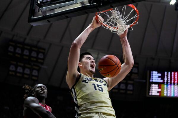 Purdue center Zach Edey (15) gets a dunk in front of Rutgers center Clifford Omoruyi (11) during the second half of an NCAA college basketball game in West Lafayette, Ind., on Jan. 2, 2023. (Michael Conroy/AP Photo)