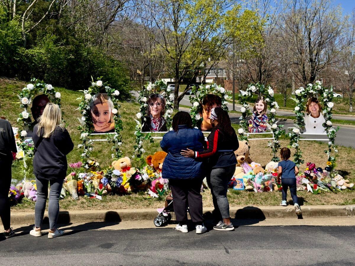 A young girl moves toward the items left in front of the photo of Hallie Scruggs, one of three nine-year-olds killed along with school staff at The Covenant School shooting in Nashville on March 27. (Chase Smith/The Epoch Times)