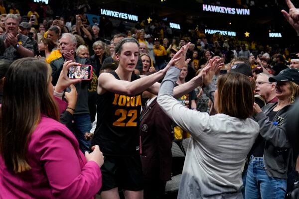 Iowa's Caitlin Clark celebrates after an NCAA Women's Final Four semifinals basketball game against South Carolina in Dallas on March 31, 2023. (Tony Gutierrez/AP Photo)