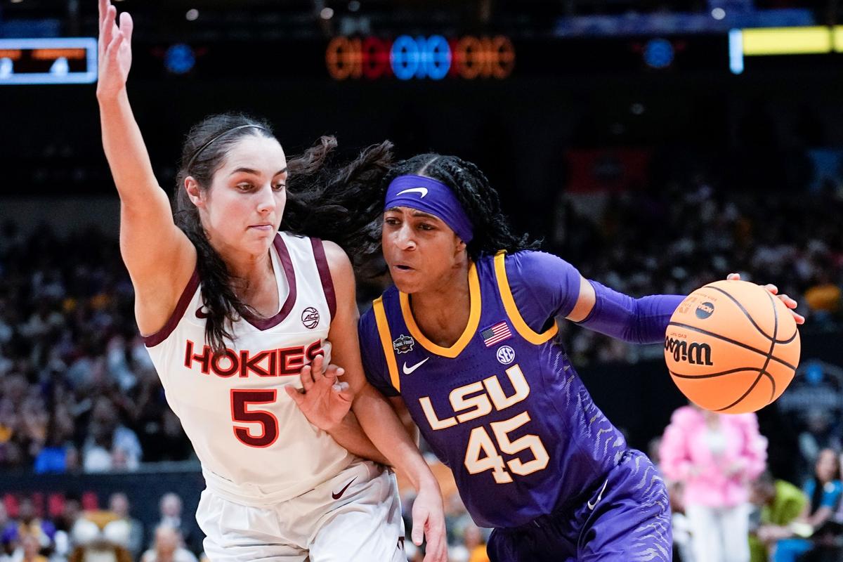 LSU's Alexis Morris drives past Virginia Tech's Georgia Amoore during the first half of an NCAA Women's Final Four semifinals basketball game in Dallas, on March 31, 2023. (Tony Gutierrez/AP Photo)