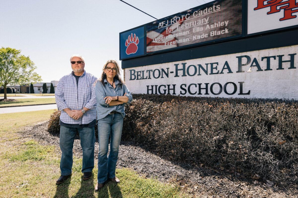 Gil and Gabriella Reid stand near Belton-Honea Path High School in Honea Path, S.C., on March 25, 2023. (Jack Robert for The Epoch Times)
