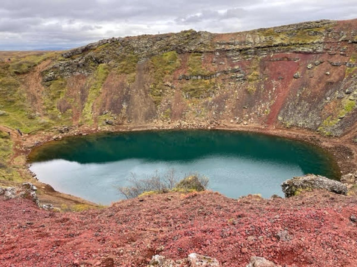 Rich rust and turquoise colors in Kerid Crater come from volcanic minerals in the soil there. (Courtesy of Lesley Frederikson)