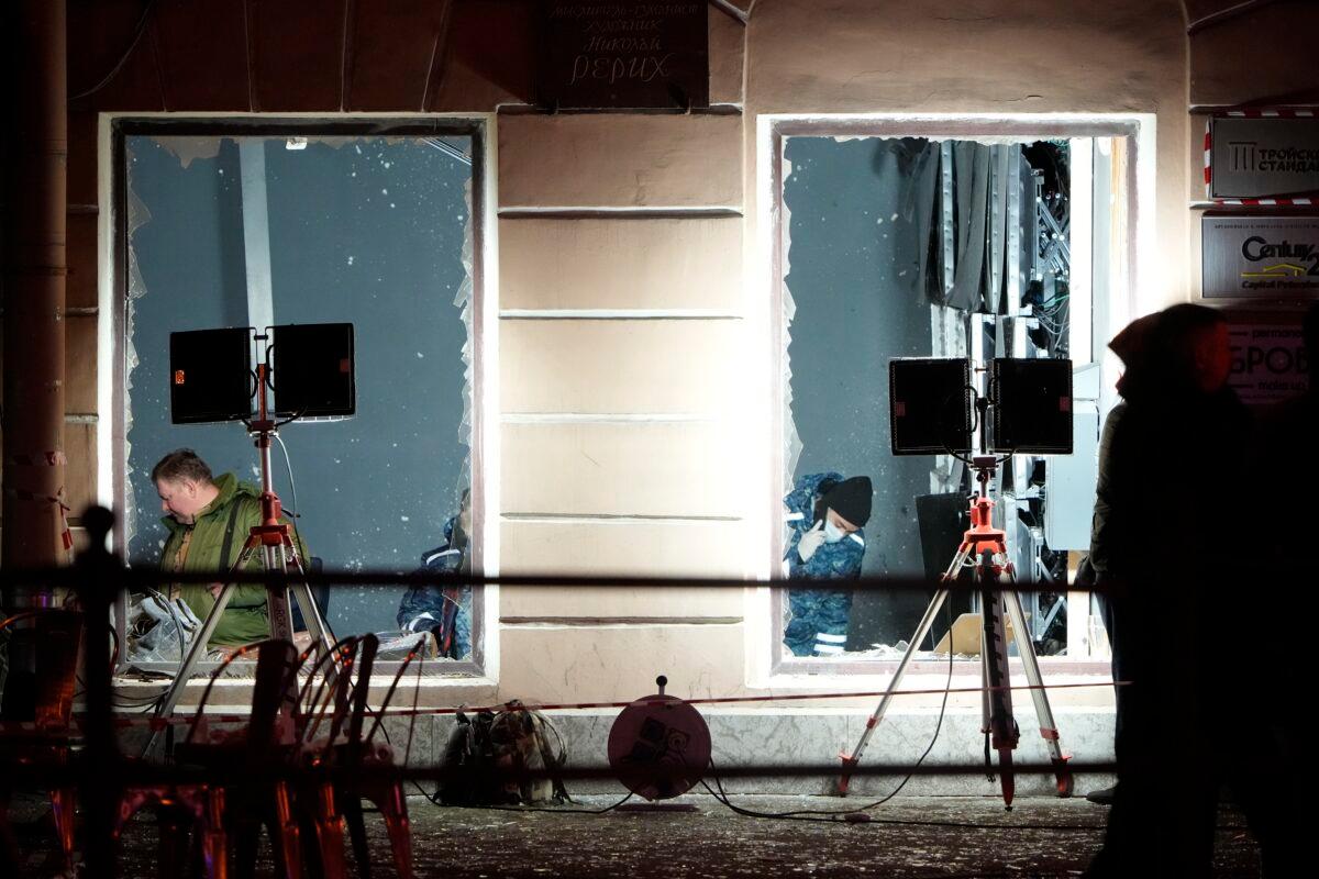 Russian investigators work at the site of an explosion at a cafe in St. Petersburg, Russia, on April 2, 2023. (AP Photo)