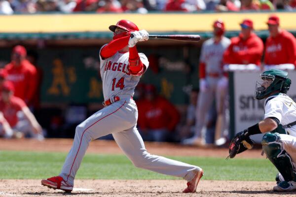 Los Angeles Angels' Logan O'Hoppe (14) hits a three-run home run in front of Oakland Athletics catcher Shea Langeliers, right, during the fourth inning of a baseball game in Oakland, Calif., on April 2, 2023. (Jed Jacobsohn/AP Photo)