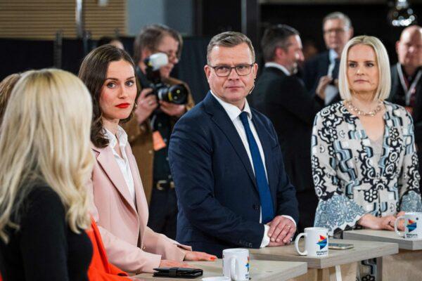 (R to L) The Finns Party chair Riikka Purra, National Coalition Party chair Petteri Orpo, and Social Democratic Party SDP chair and Finnish Prime Minister Sanna Marin react during a live broadcast from the Pikkuparlamentti during an official election event following the Finnish parliamentary elections in Helsinki on April 2, 2023. (JONATHAN NACKSTRAND/AFP via Getty Images)
