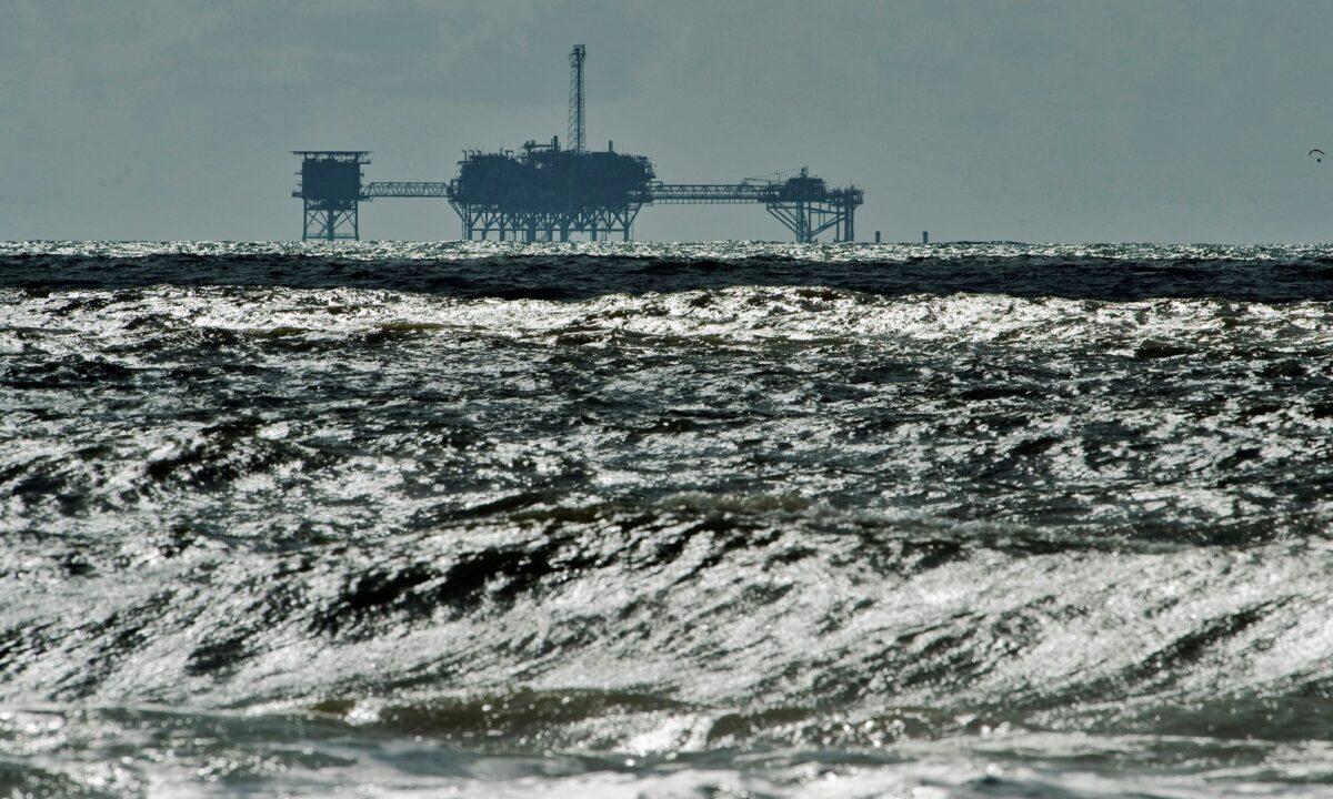 An oil and gas drilling platform stands offshore near Dauphin Island, Ala., in the Gulf of Mexico on Oct. 5, 2013. (Steve Nesius/Reuters)