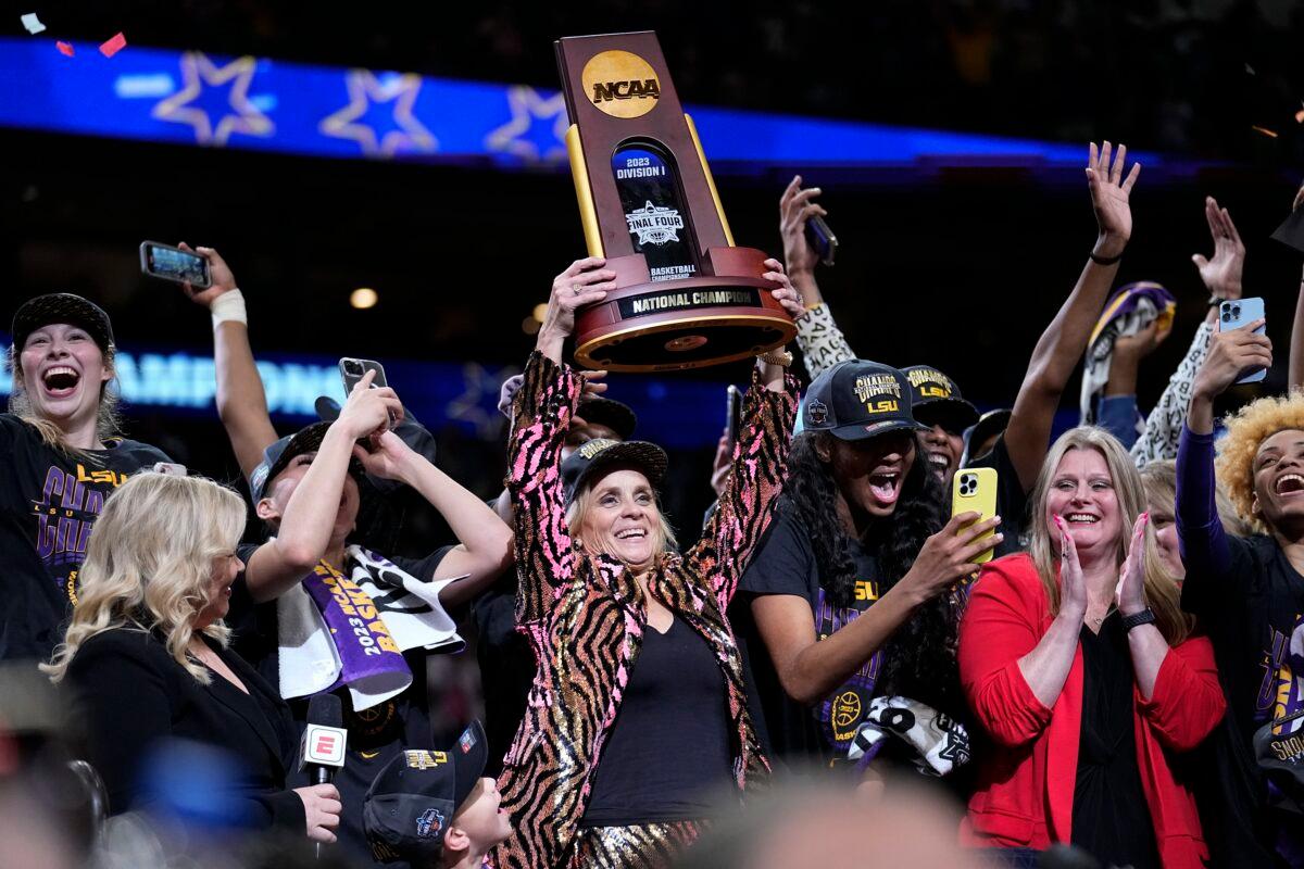 LSU head coach Kim Mulkey holds the winning trophy after the NCAA Women's Final Four championship basketball game against Iowa in Dallas on April 2, 2023. (Tony Gutierrez/AP Photo)