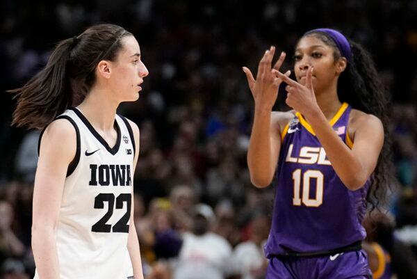 LSU's Angel Reese reacts in front of Iowa's Caitlin Clark during the second half of the NCAA Women's Final Four championship basketball game in Dallas on April 2, 2023. (Tony Gutierrez/AP Photo)